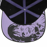 Close-up of a cap with a graphic design on the purple brim