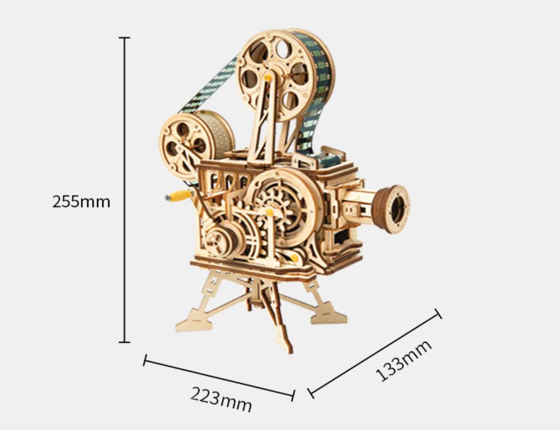 Mechanical model of a vintage movie projector with dimensions indicated on a white background. Vitascope mechanical gear model packaging on a white background 3D Puzzle made of wood of a vintage movie projector