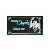 Cover of Charlie Chaplin flipbook with black and white image of Chaplin and text on a white background. Flip book at the Academy Museum Store Los Angeles