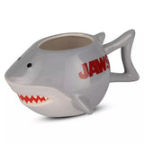 Shark-shaped mug with 'JAWS' text on a white background Jaws Ceramic Mug