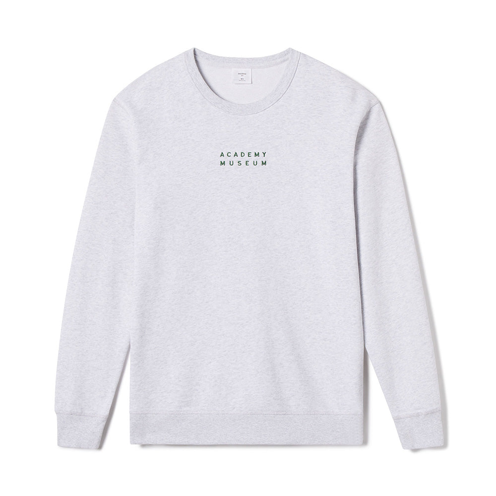 Gray long-sleeve shirt with 'Academy Museum' logo on a white background