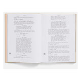 Open book with screenplay lines pages on a white background