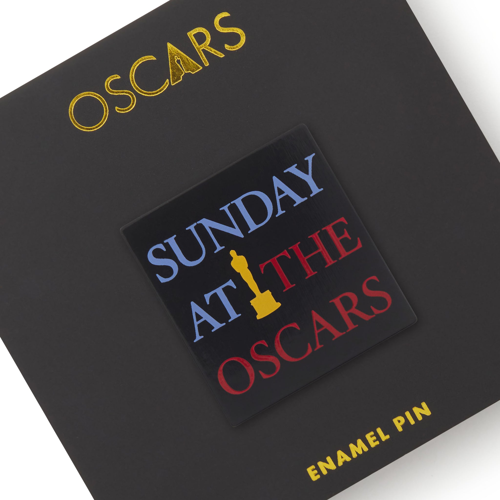 Enamel pin with 'Sunday at the Oscars' text on a black background with 'Oscars' branding.