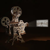 Vintage-style movie projector with a projected film scene on a dark background 3D Puzzle for Kids Children Vitascope mechanical gear model packaging on a white background 3D Puzzle made of wood of a vintage movie projector