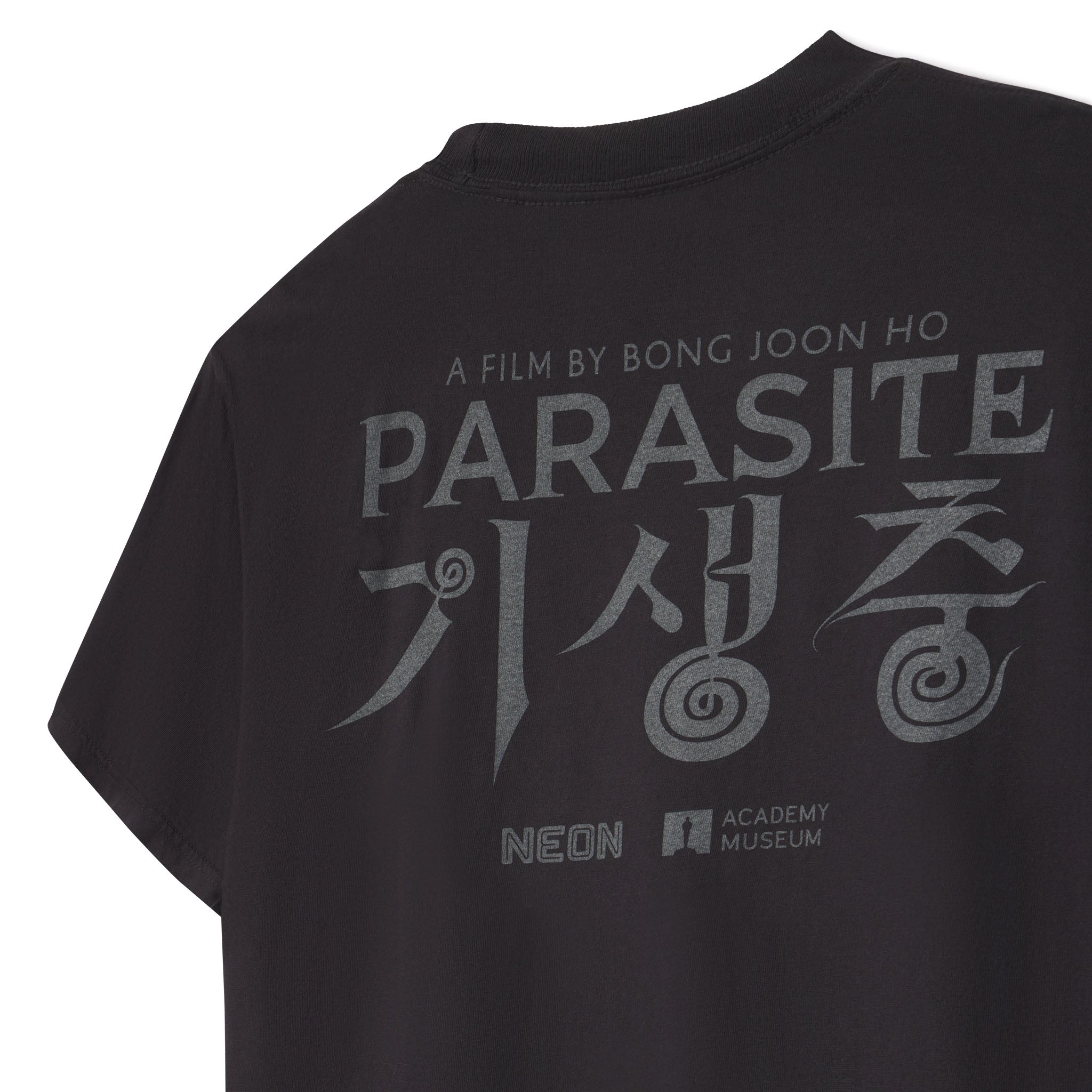 Black t-shirt with 'Parasite' movie title and logos on a white background