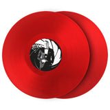 Two red vinyl records with a black and white cover on a white background