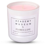 Candle in a white container with 'Academy Museum x Flores Lane' label on a white background FLORES LANE MOVIE GENRE SCENTED CANDLE: PERIOD MOVIE | ACADEMY MUSEUM
