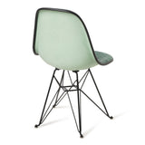 Green chair with black metal legs on a white background