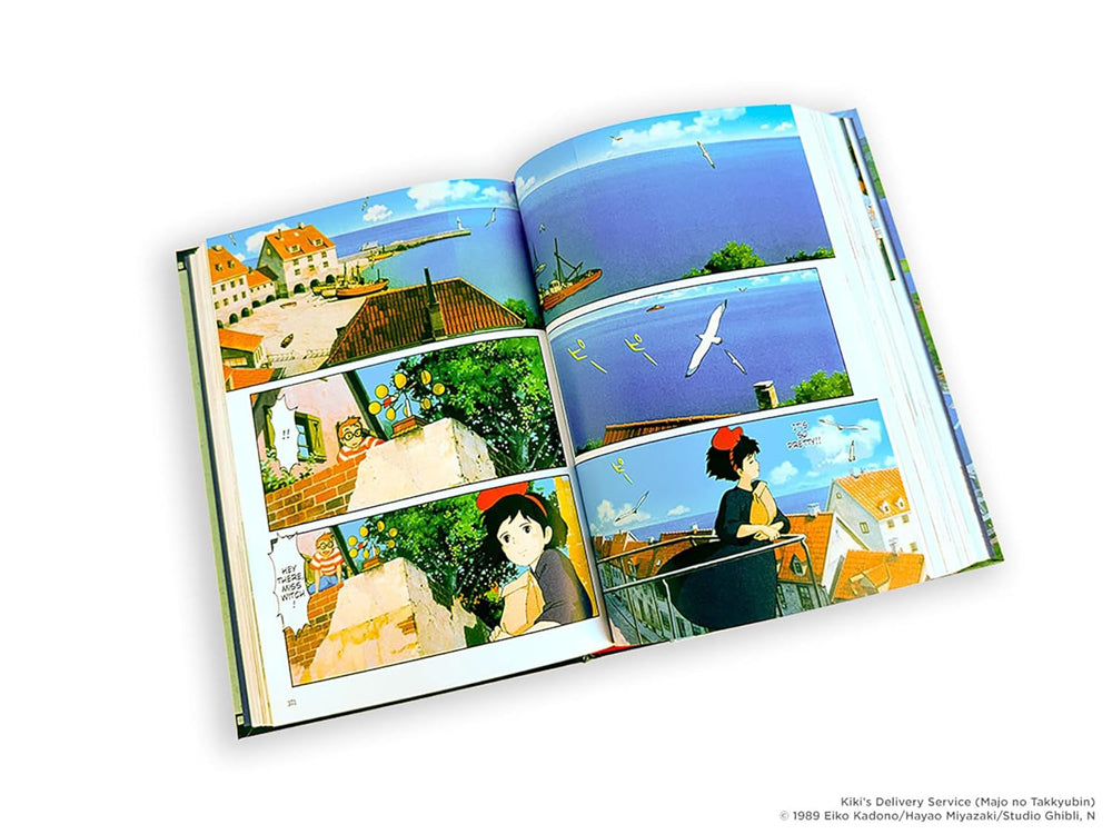 Open book displaying a colorful comic strip with various scenes and characters from Studio Ghibli anime movies