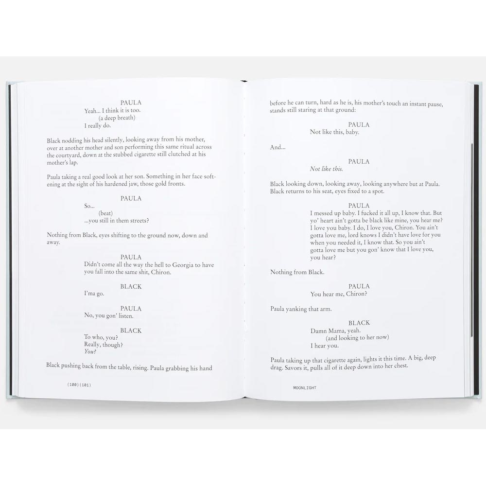 Open book with screenplay text on a white background