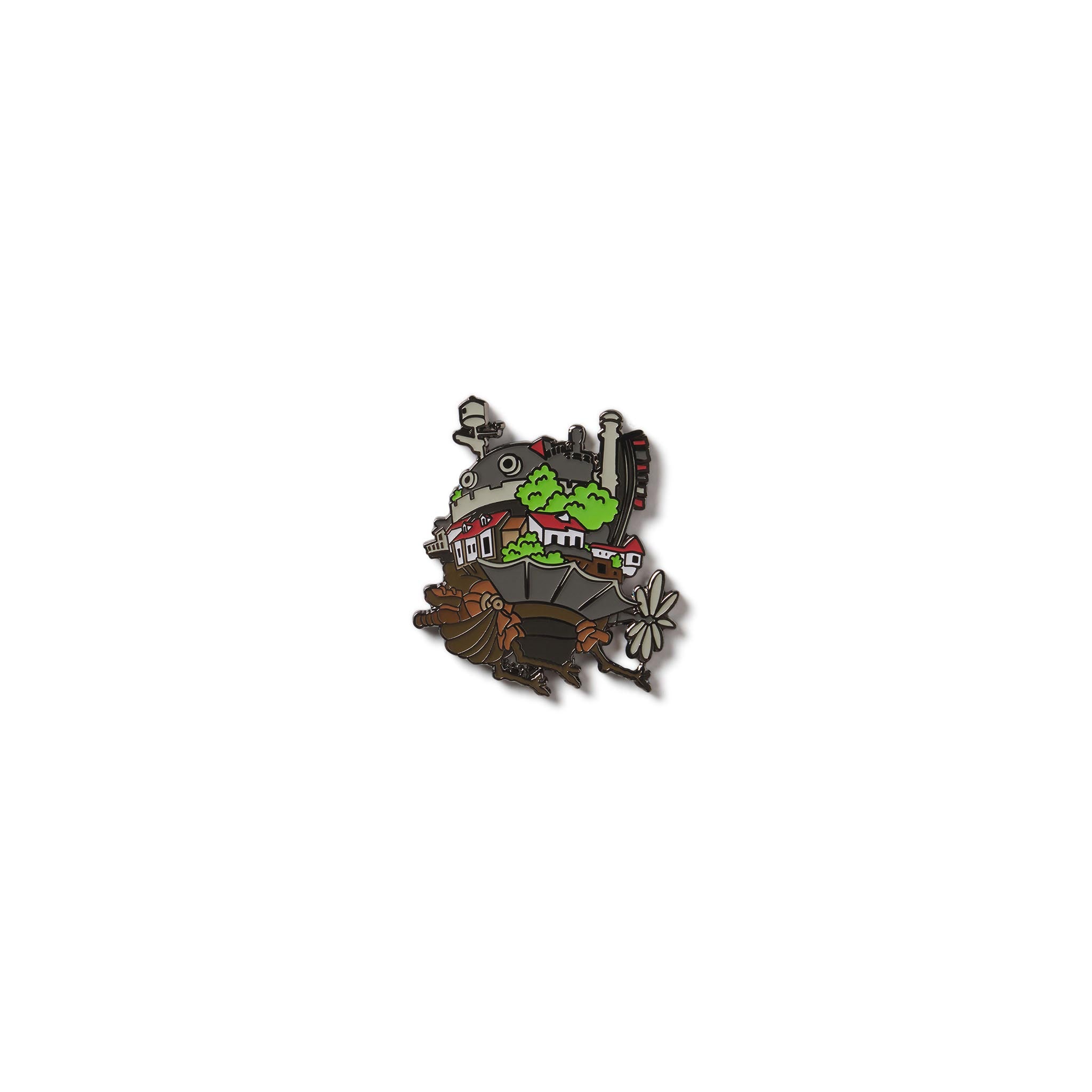 Decorative pin with castle and landscape design on a white from the Studio Ghibli Hayao Miyazaki movie Howl's Moving Castle on a white background