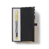 Gold pen in a black box on a white background. Oscar Statue the Academy Awards Show official Oscars Logo Merchandise Collectible ballpoint pen in Oscars logo gift box.