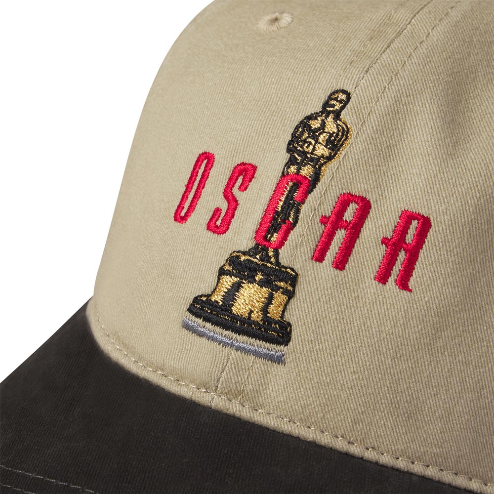 Beige cap with embroidered Oscar statue and 'OSCAR' text on a white background