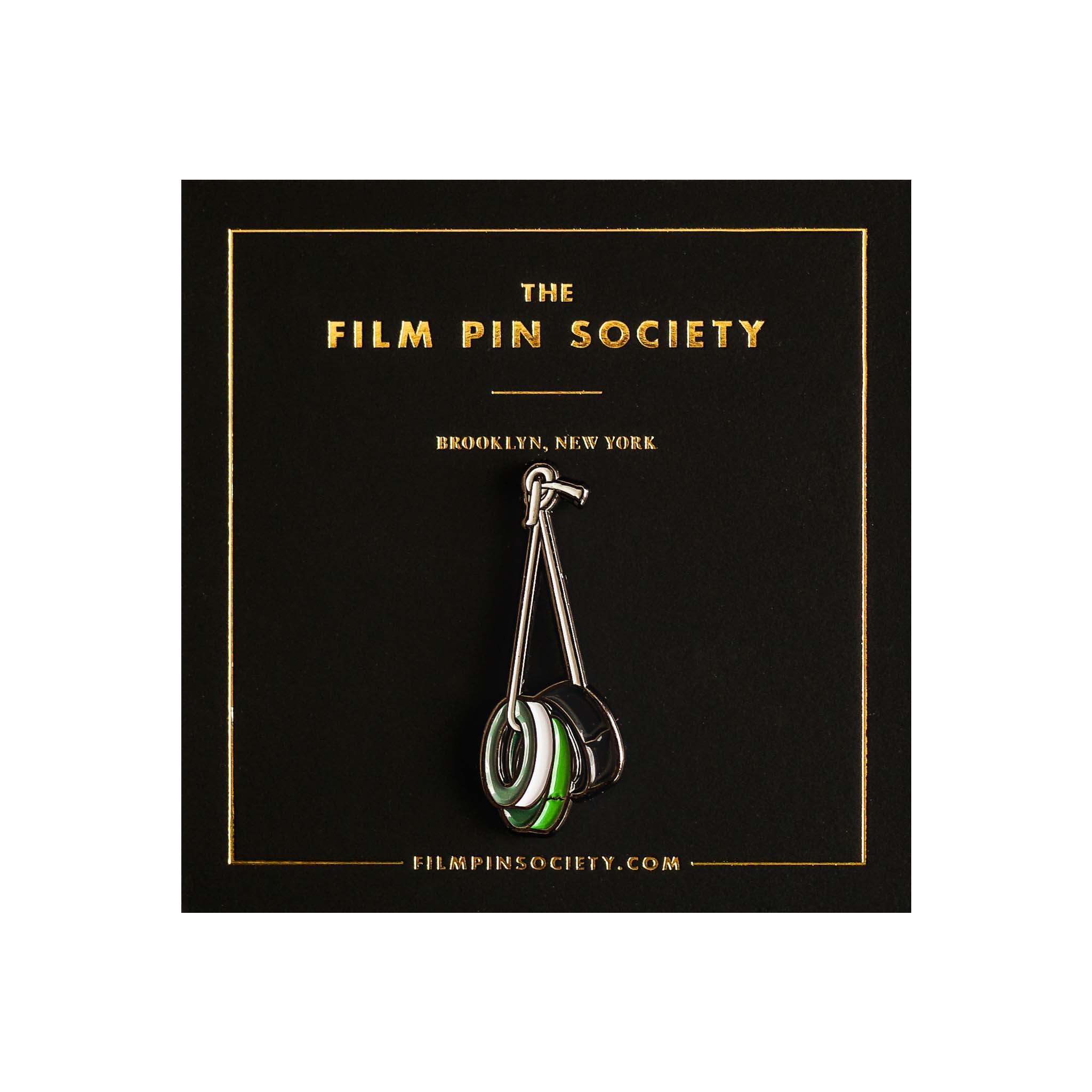 gaffing tape pin on a black card with 'The Film Pin Society' branding