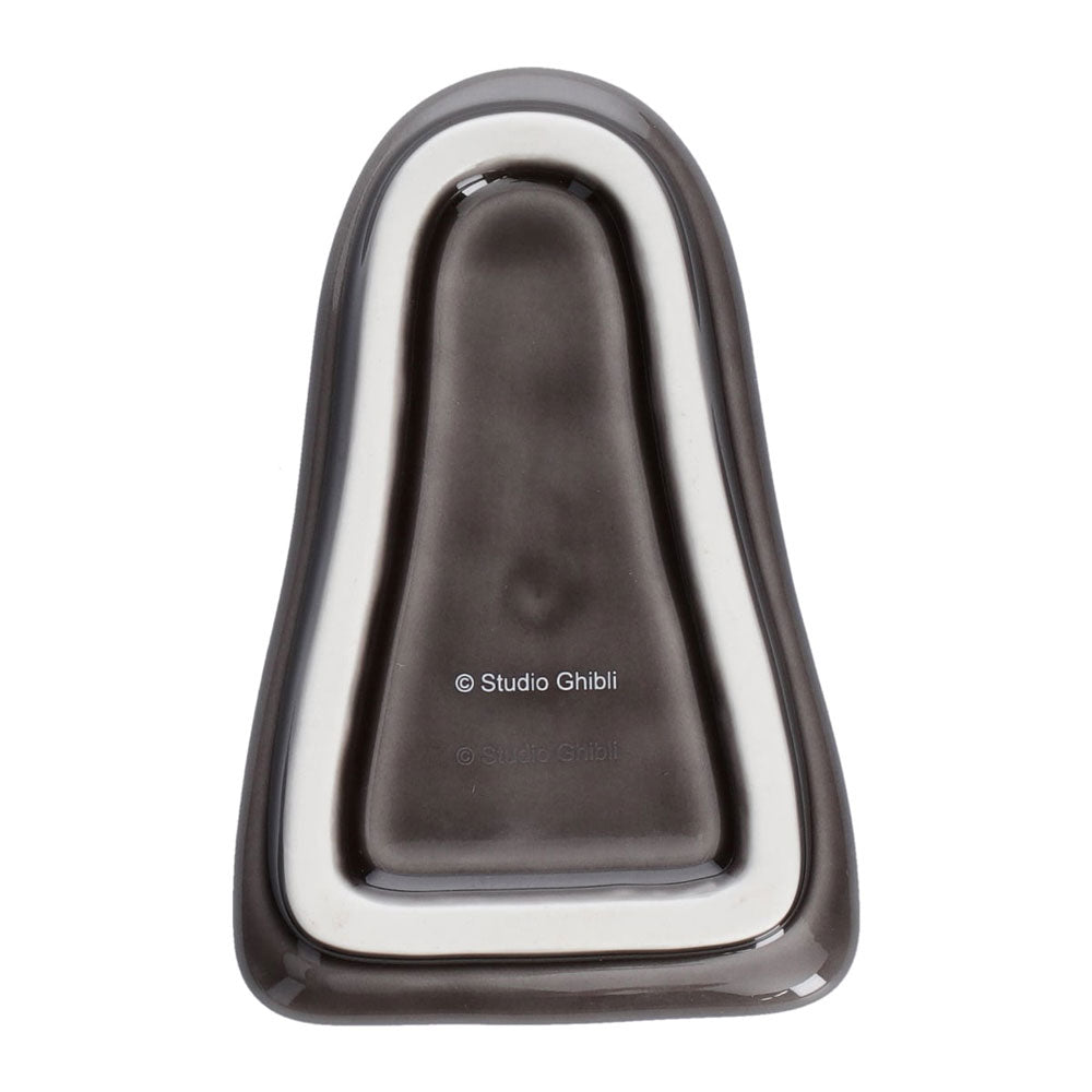 Gray and silver object with 'Studio Ghibli' branding on a white background