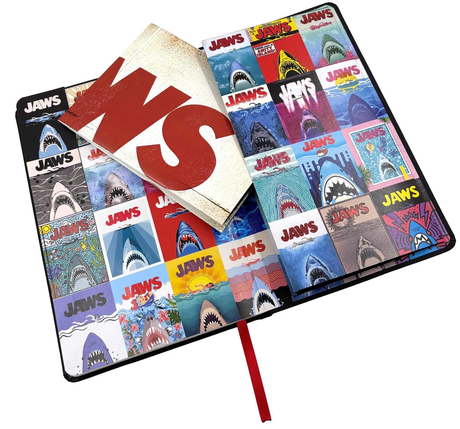 Notebook with 'Jaws' cover design featuring shark illustrations on a white background. Back pocket on the notebook back cover holds a bonus Jaws movie poster Jaws Hardcover Journal Hardcover 50th Anniversary Edition