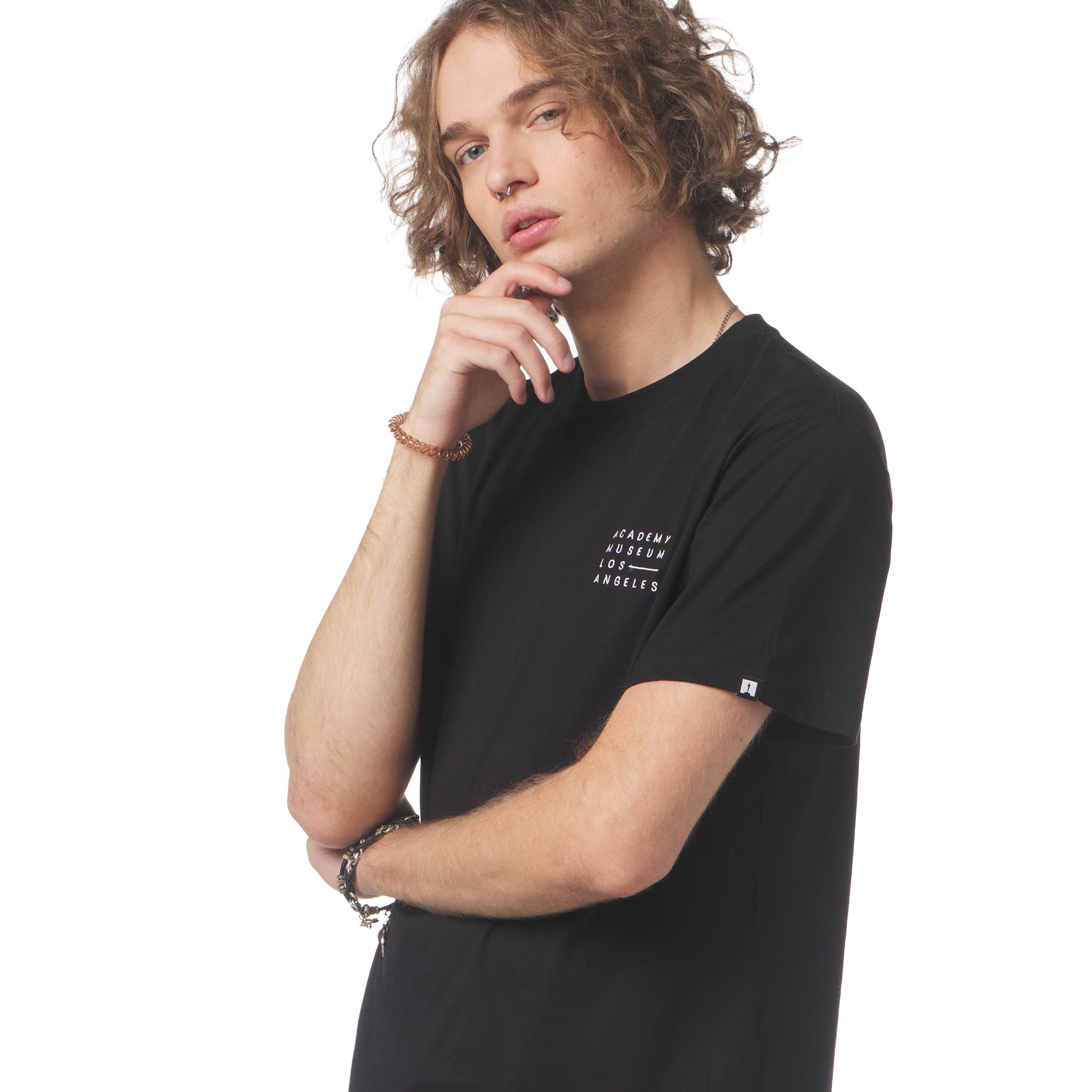 Person wearing a black t-shirt with text on a white background