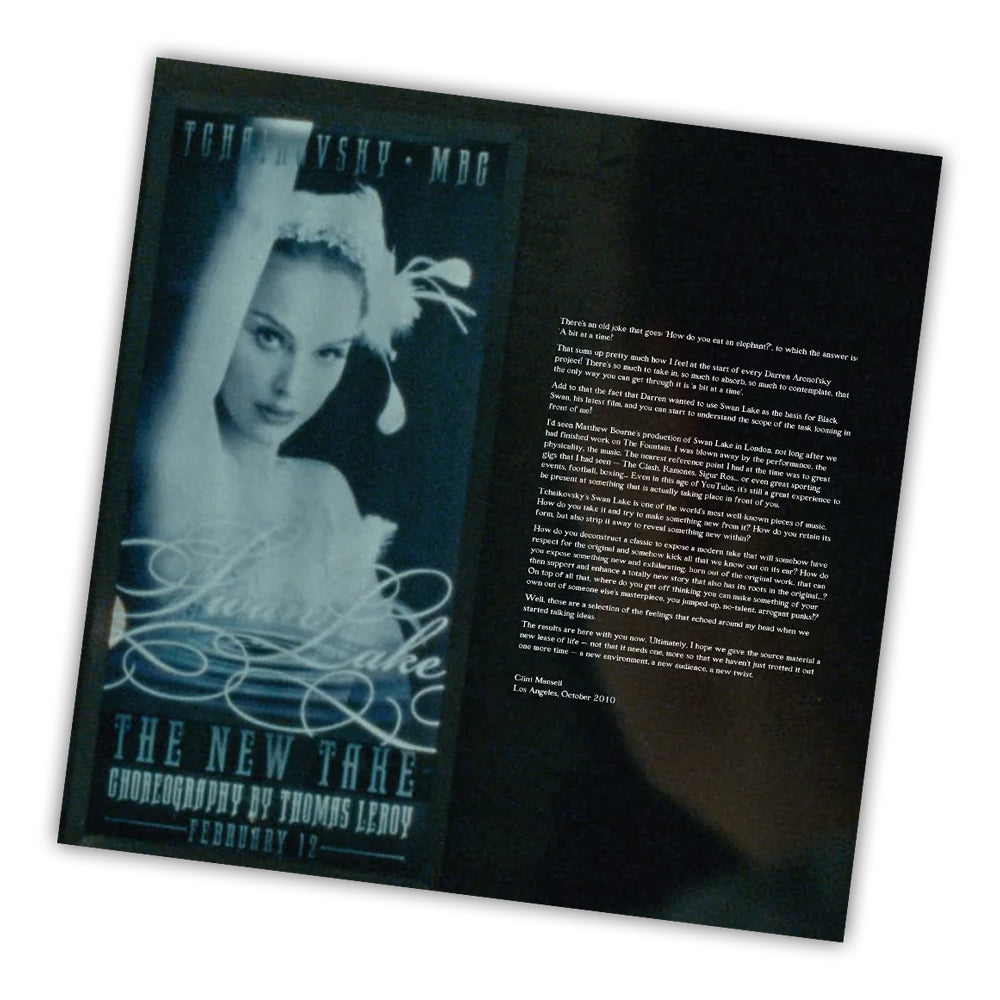 Open book with a black cover featuring a dancer and text on a white background