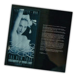 Open book with a black cover featuring a dancer and text on a white background