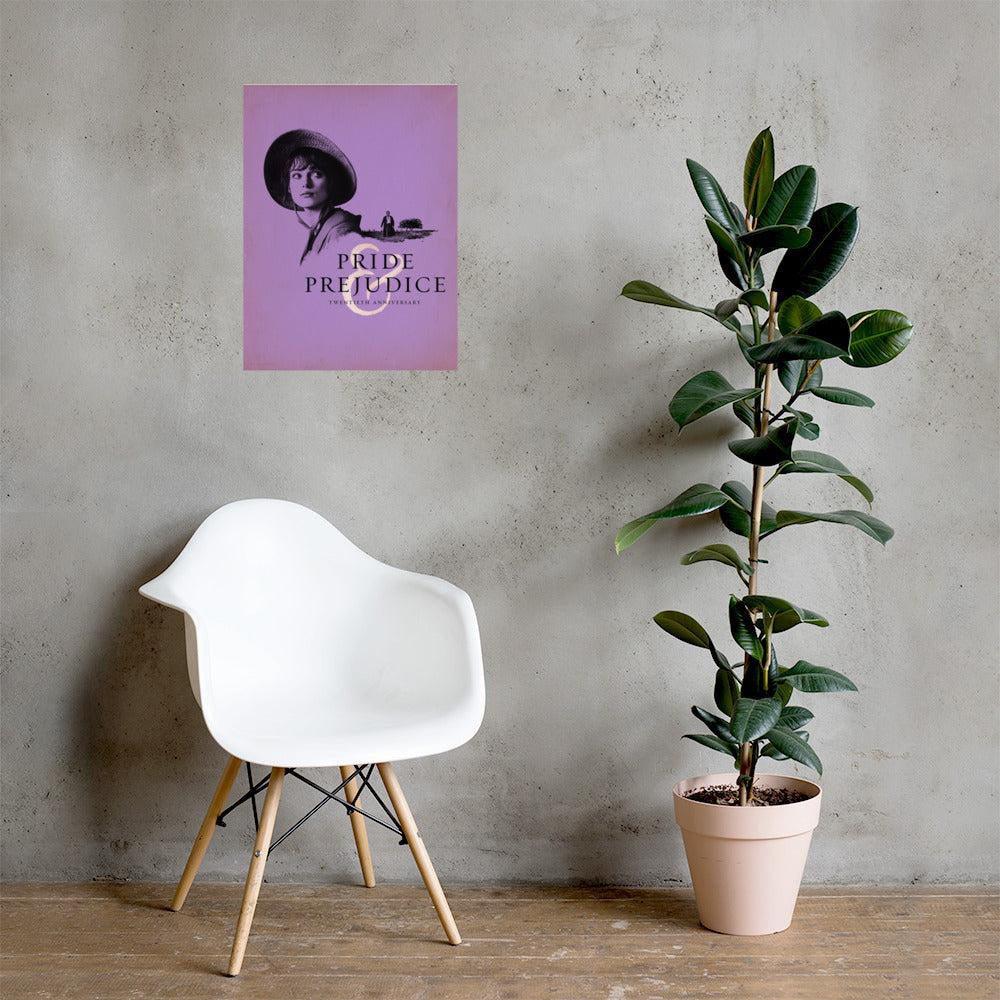 White chair next to a potted plant with a 'Pride and Prejudice' poster on a gray wall. 20th Anniversary edition poster at The Academy Museum Store