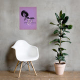 White chair next to a potted plant with a 'Pride and Prejudice' poster on a gray wall. 20th Anniversary edition poster at The Academy Museum Store