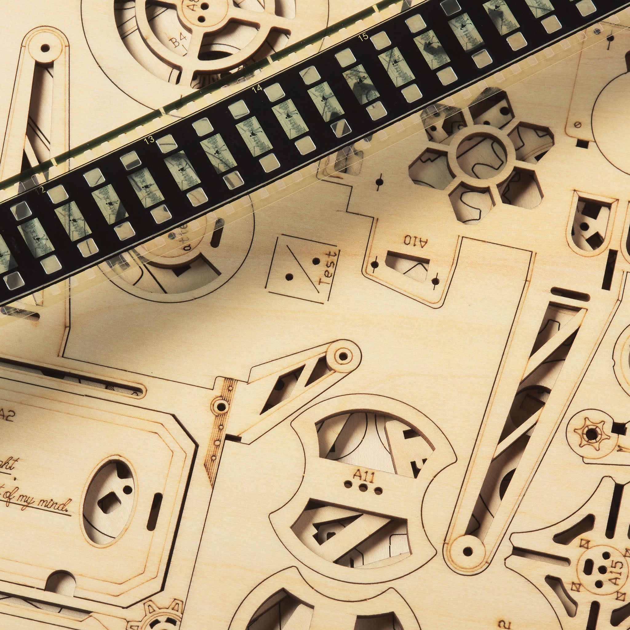 Close-up of a mechanical wooden puzzle with gears and components.