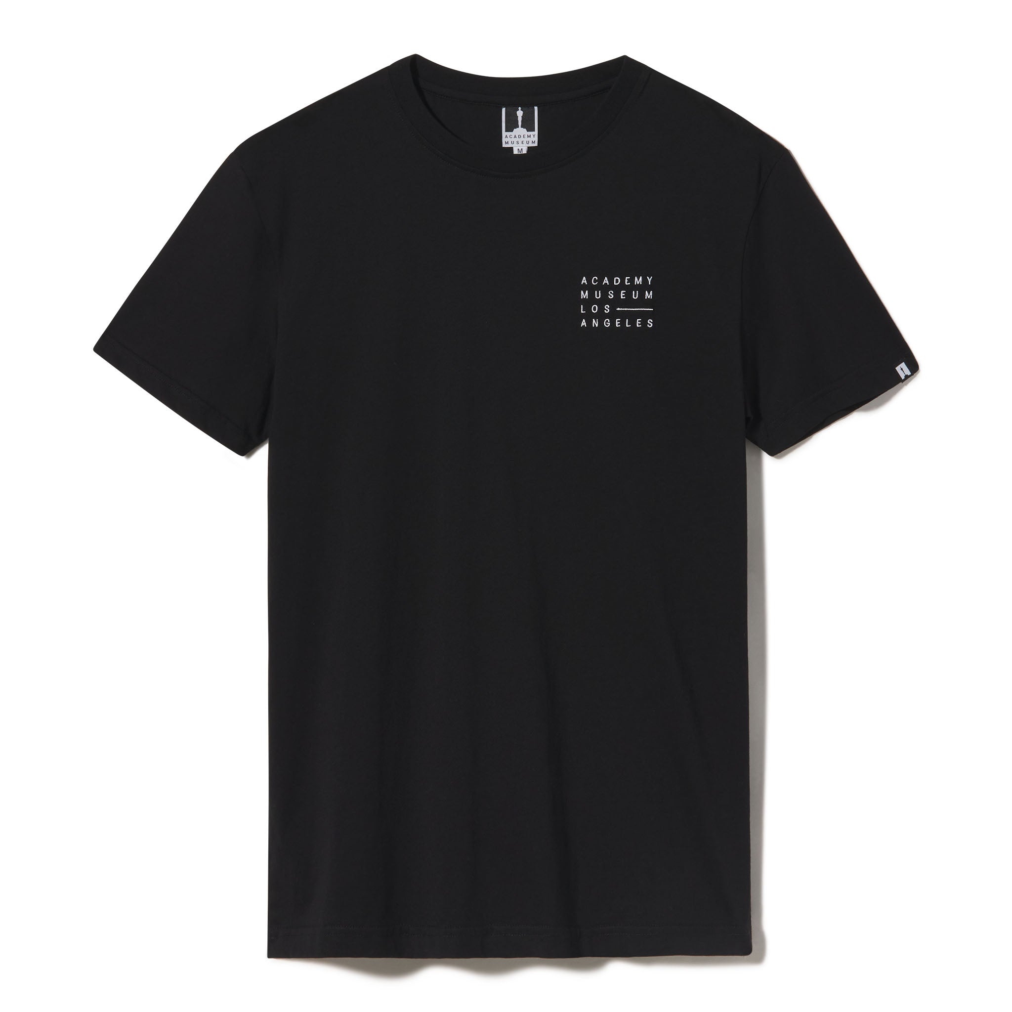 Black t-shirt with white text on a white background featuring the Academy Museum embroidered logo. Adult Men's Tshirt Adult Women's T-Shirt