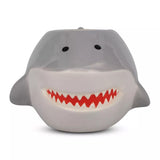Shark-shaped ceraimic mug with a smiling face on a white background