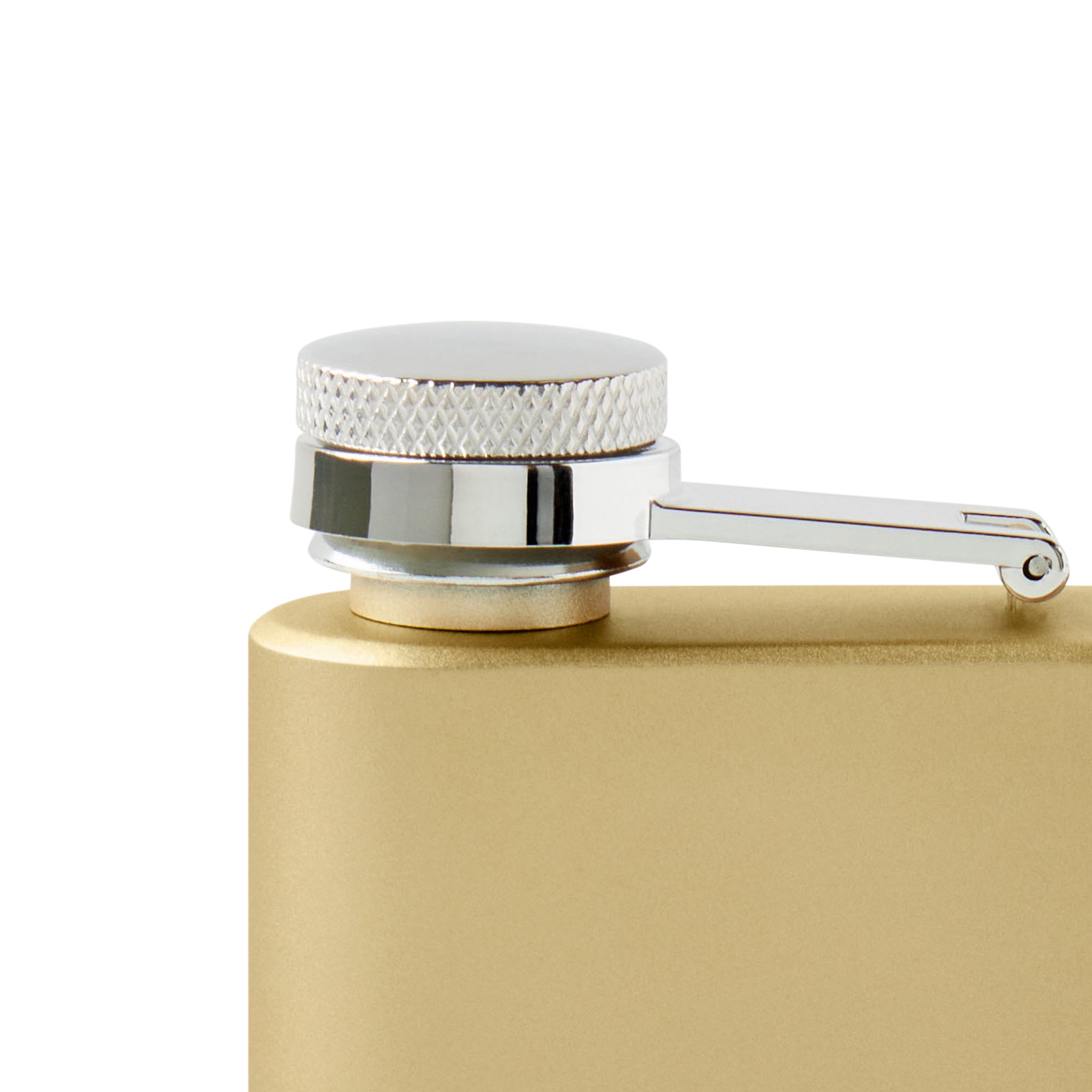 Gold flask with silver cap on a white background