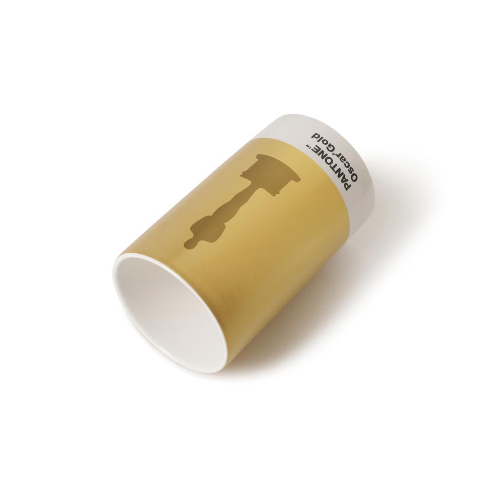 Gold cylindrical container with a white lid on a white background. ceramic pencil cup holder Oscar Statue