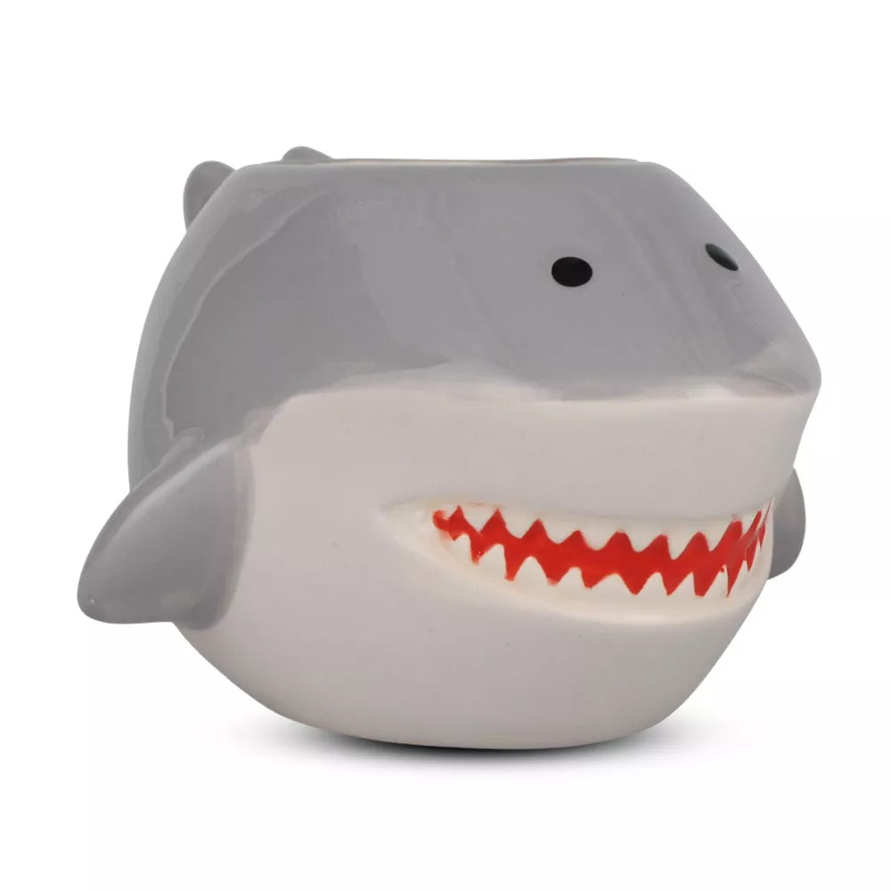 Gray shark-shaped ceramic drinking mug with handle with red interior on a white background