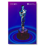A collectible postcard featuring the 96th Oscars show poster art with a glossy finish. The postcard displays the official poster depicting a golden Oscars statuette against a blue background with a circular blue pattern around the base of the statue.