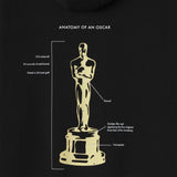Black hoodie with gold illustration of an Oscar statuette and text details on a black background