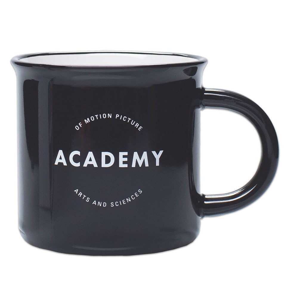 A glossy black ceramic mug with the ACADEMY logo printed on the side against a white background.