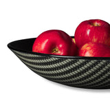 Explore Kiku Handmade's stunning black glass bowl, adorned with a film graphic. Each piece is meticulously crafted by Laurie Freivogel in Chicago, merging art and design.