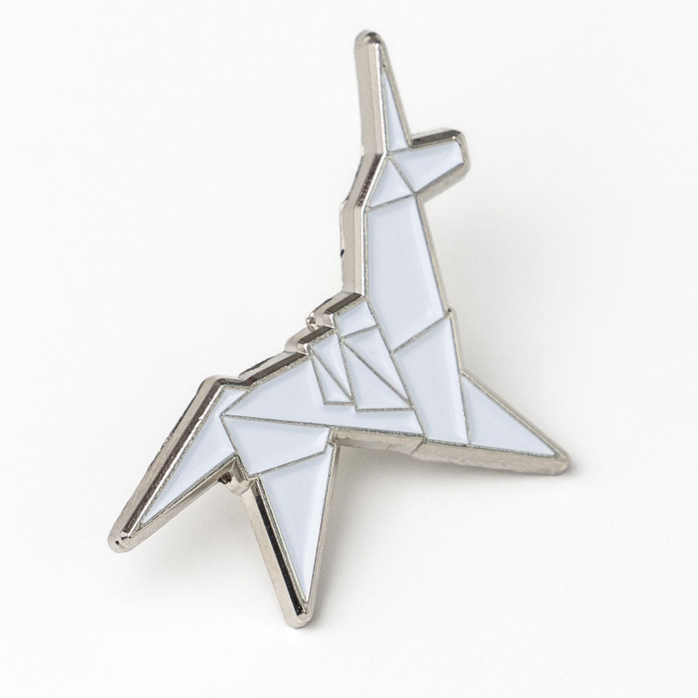 Geometric star-shaped object with a white and silver design on a white background
