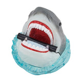 closeup image of jaws the great white shark bath bomb for the tub with a canister in his mouth