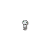 A small enamel pin featuring the character Kodama from the movie Princess Mononoke. The pin is black and white, with the character glowing in the dark.