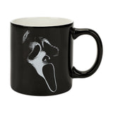 Black mug with white graphic design on a white background. Sip your favorite drink in style with our Ghost Face Lives 16 Oz. Ceramic Mug! Perfect for Scream fans, it's microwave and dishwasher safe for easy care.