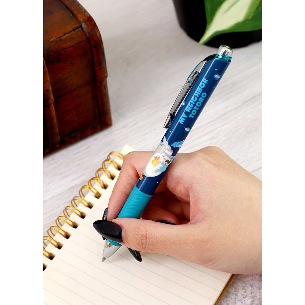 Hand holding a blue pen with a character design on a notebook. Studio Ghibli My Neighbor Totoro Ballpoint Pen (Totoro’s Umbrella)