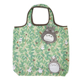 A green reusable shopping bag with a pattern of leaves and Totoro characters from the anime My Neighbor Totoro.
