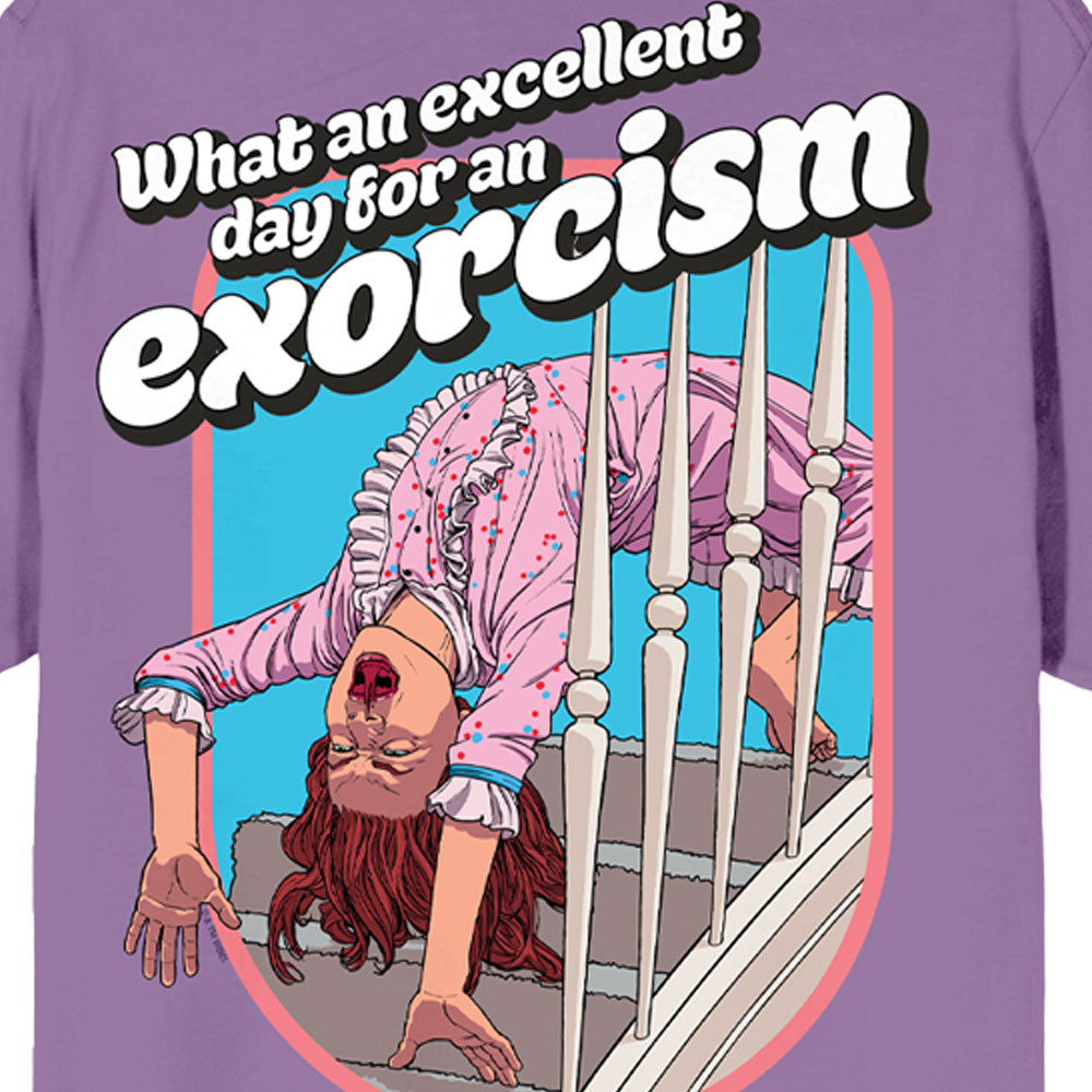 T-shirt with a graphic of a person exorcising a demon and text 'What an excellent day for an exorcism' on a purple background. Embrace the chilling vibe of THE EXORCIST (1973) with our unisex T-shirt featuring Regan's iconic backbend and the quote, "What an excellent day for an exorcism."