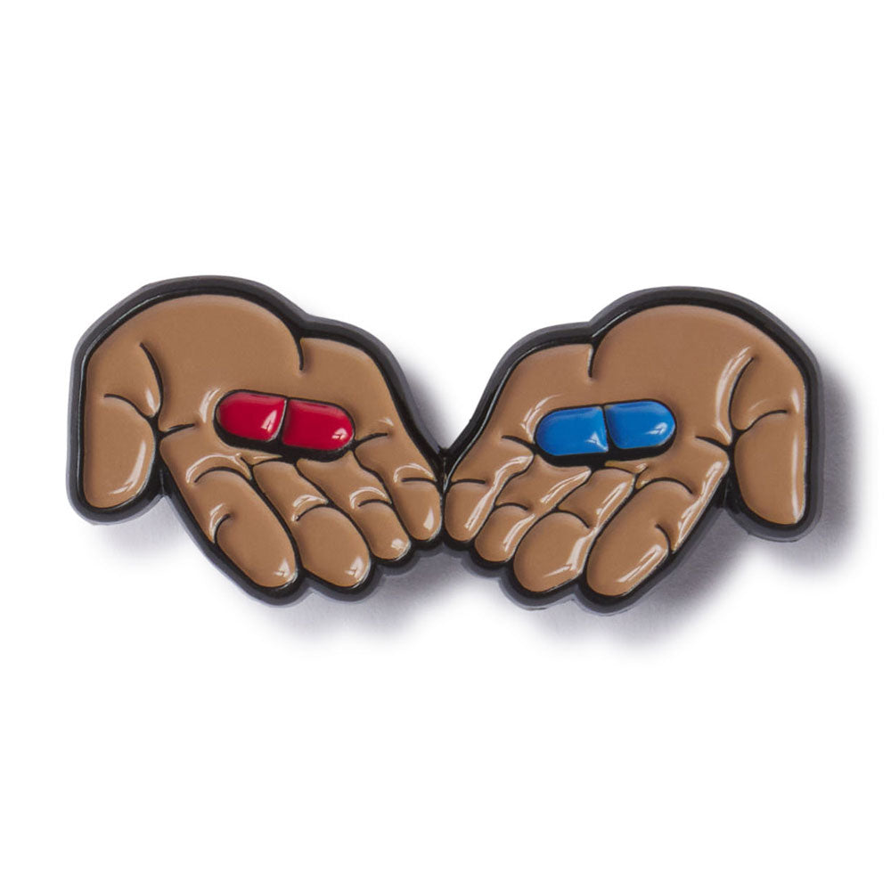Decorative item with hands holding a red and blue pill on a white background