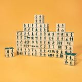 Stack of wooden blocks with illustrated figures on a yellow background Uncle Goose makes wooden toys and decor handcrafter in Grand Rapids, Michigan, using choice materials from around the Great Lakes.  Uncle Goose toys are the building blocks of creativity. In a child's hands, Uncle Goose blocks can become anything. Use them to inspire your imagination. 100% Made in the USA.