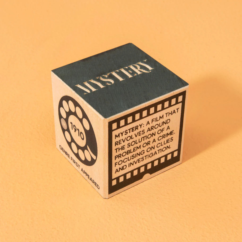 Wooden block with 'Mystery' theme on a yellow background Uncle Goose makes wooden toys and decor handcrafter in Grand Rapids, Michigan, using choice materials from around the Great Lakes.  Uncle Goose toys are the building blocks of creativity. In a child's hands, Uncle Goose blocks can become anything. Use them to inspire your imagination. 100% Made in the USA.