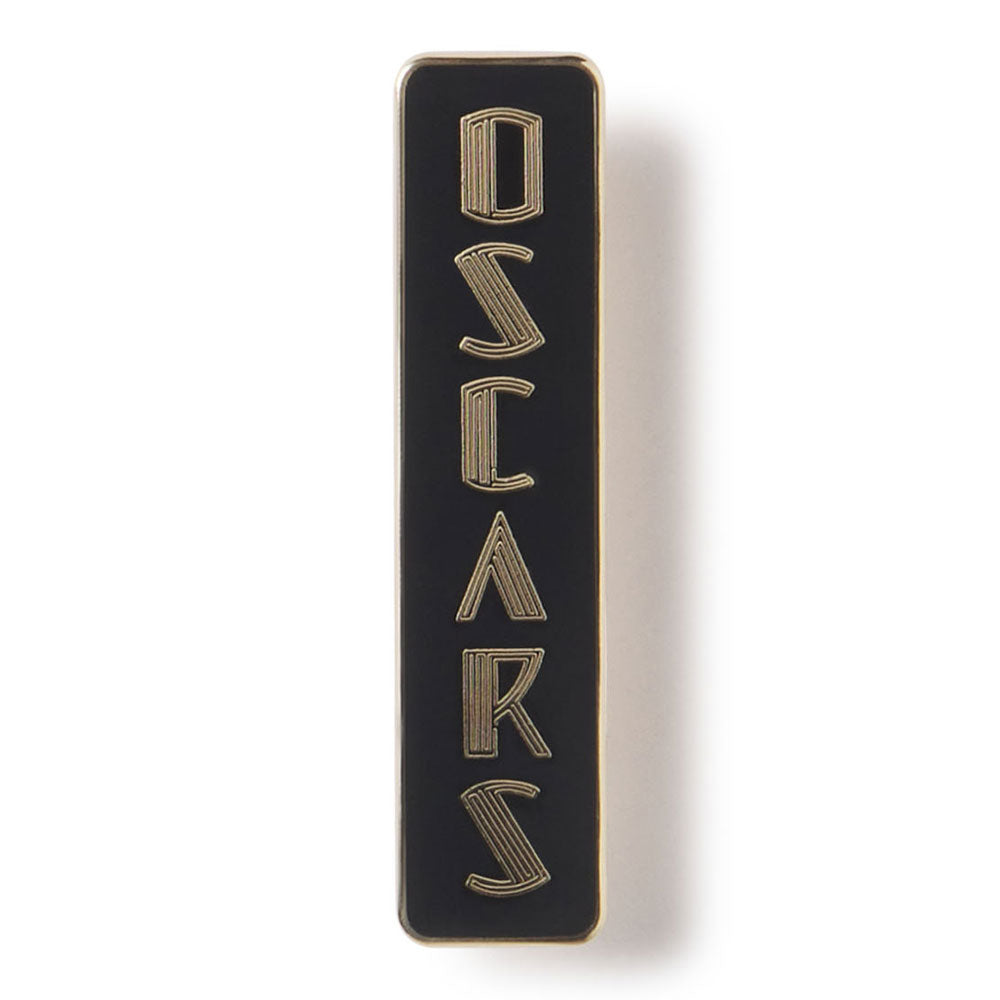 Black and gold rectangular object with 'OSCAR' text on a white background