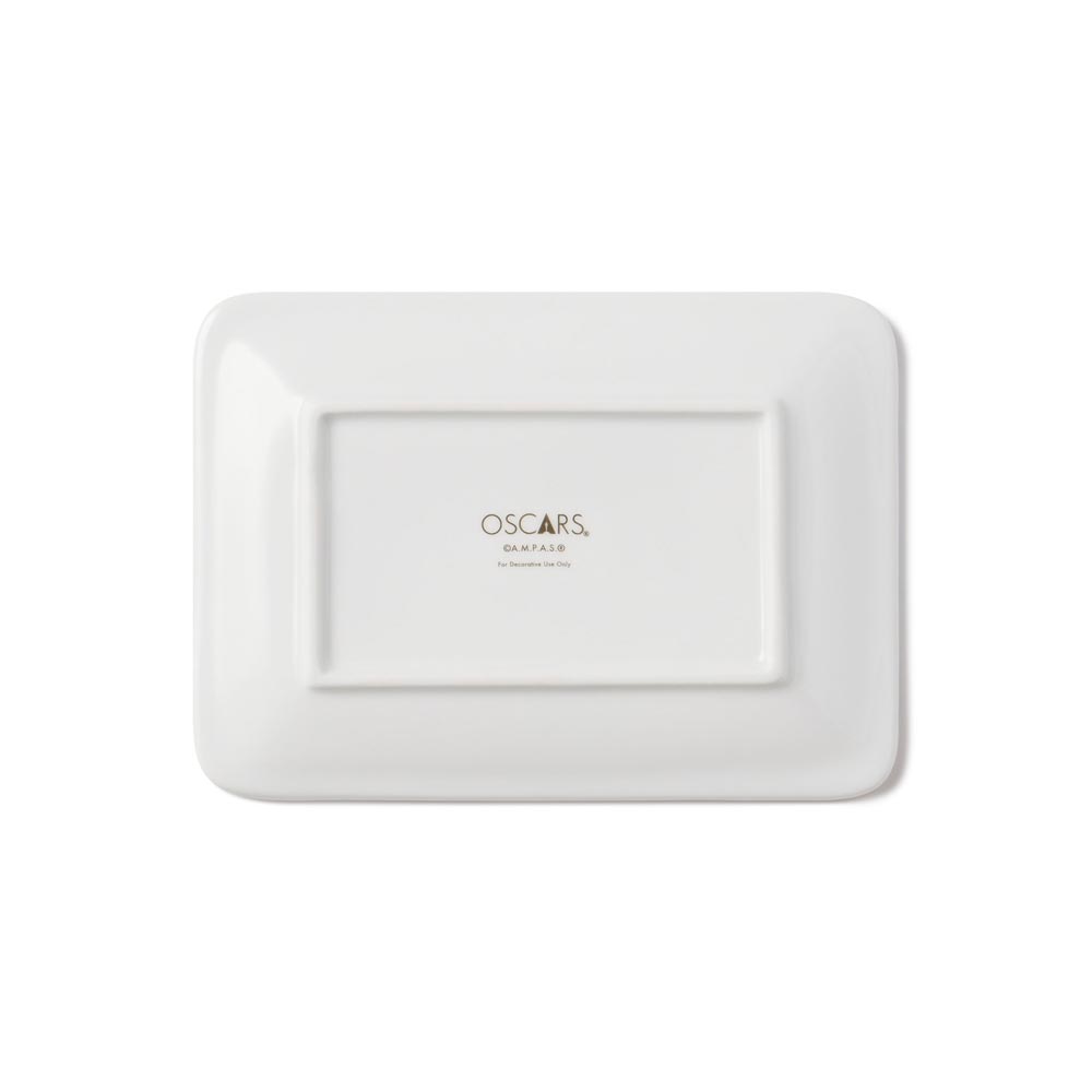 Back view of the ceramic plate rectangle all whitewith gold Oscars logo printed.