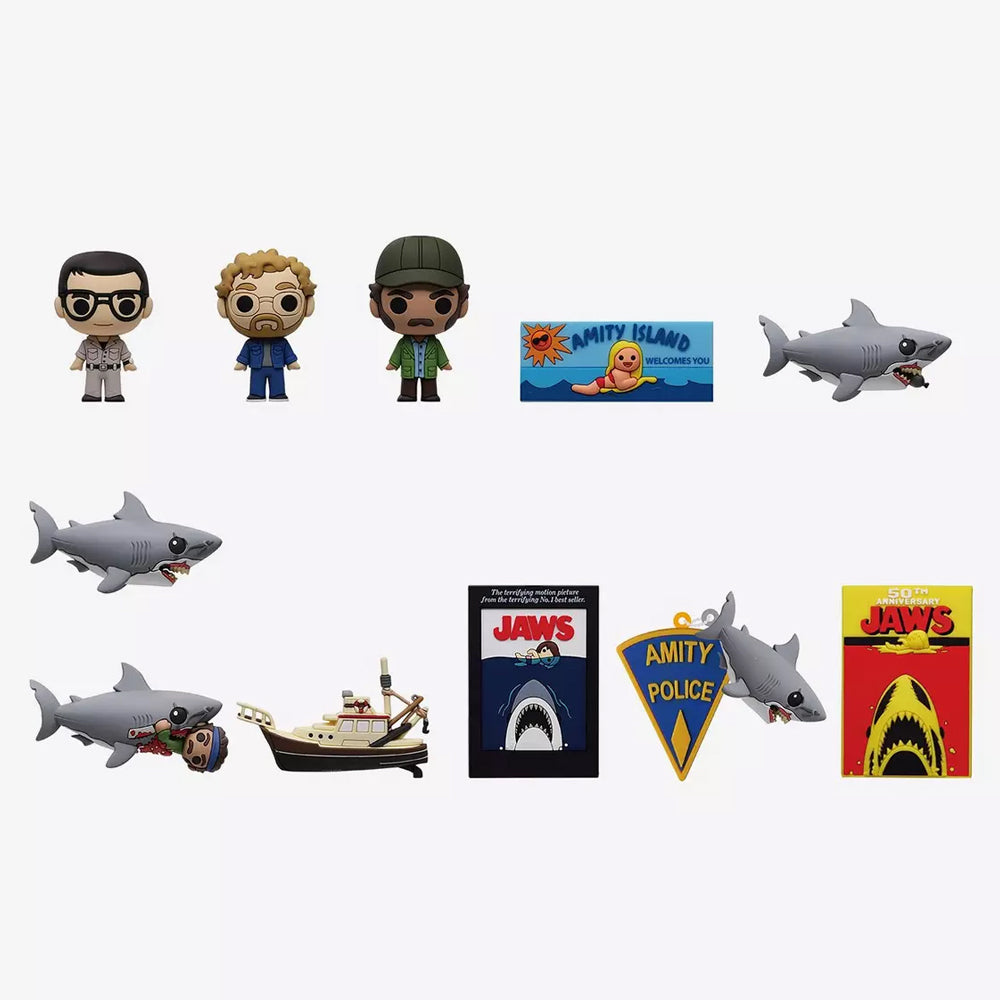 Collection of Jaws-themed figurines and memorabilia on a white background
