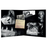 Memorial book for Titanic victims with black and white images and a couple embracing.