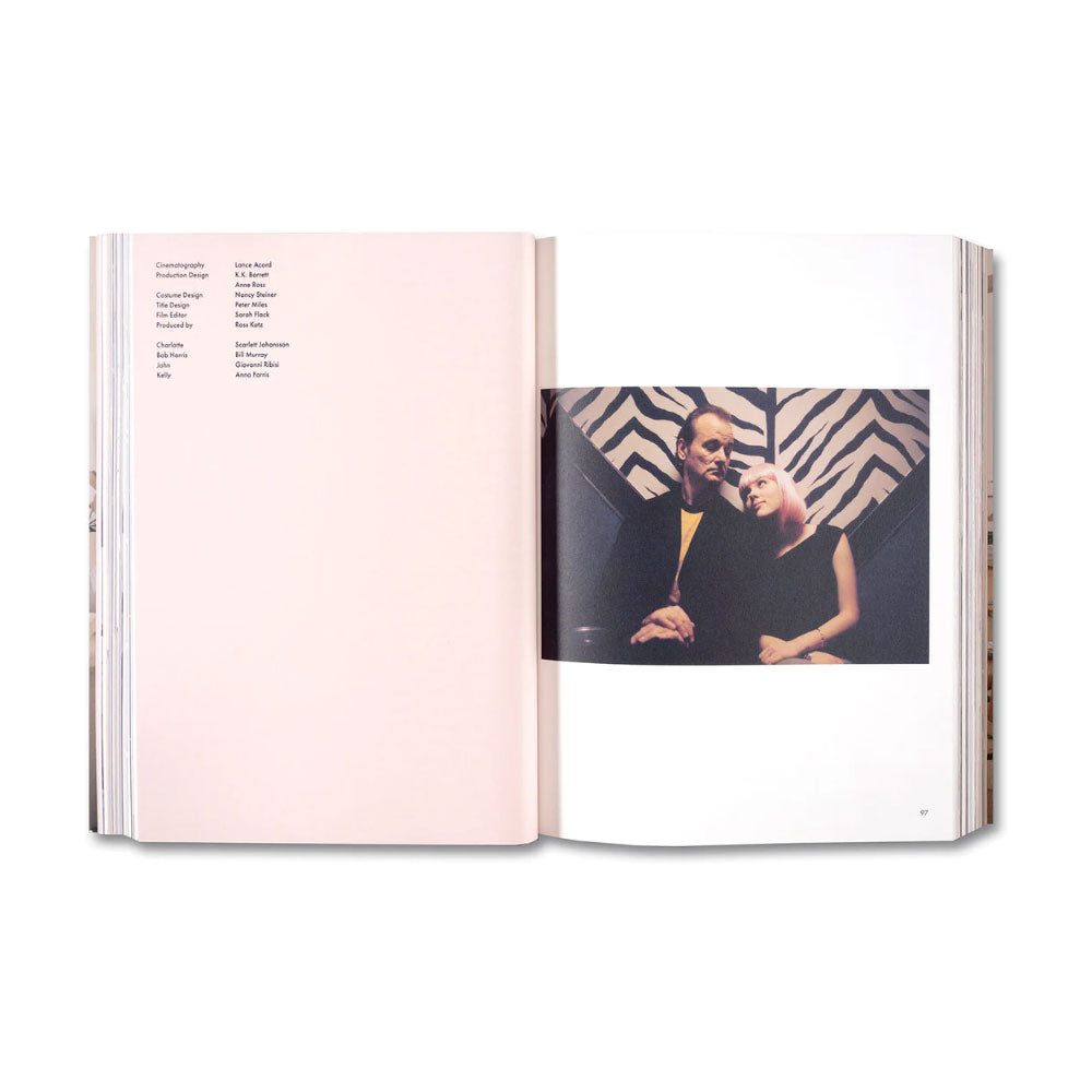 Open book showing a photograph of two people against a patterned background